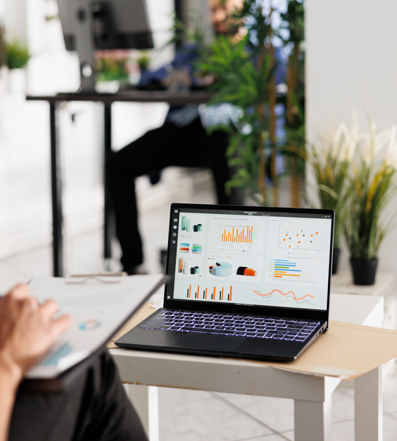 Services 1 employee-reviewing-sales-data-laptop-screen-budgeting-strategy-business-office-worker-analyzing-metrics-statistics-charts-portable-computer-coworking-space